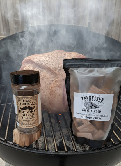 Tennessee Cornish Game Hens packaging with Old Tomball Hickory Blend seasoning on a woodchunk from Tennessee Cooking Wood