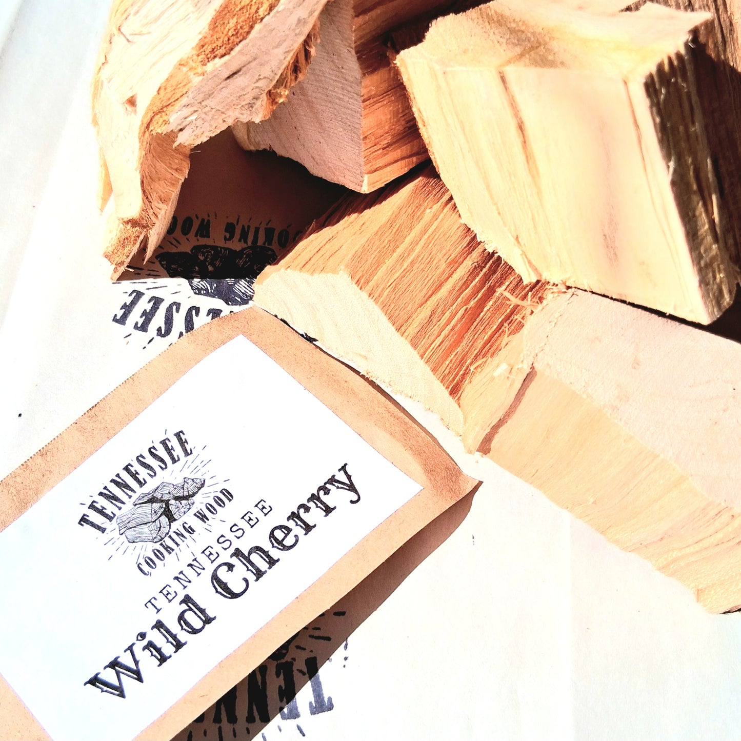 Tennessee Wild Cherry wood chunks with packaging on a white background